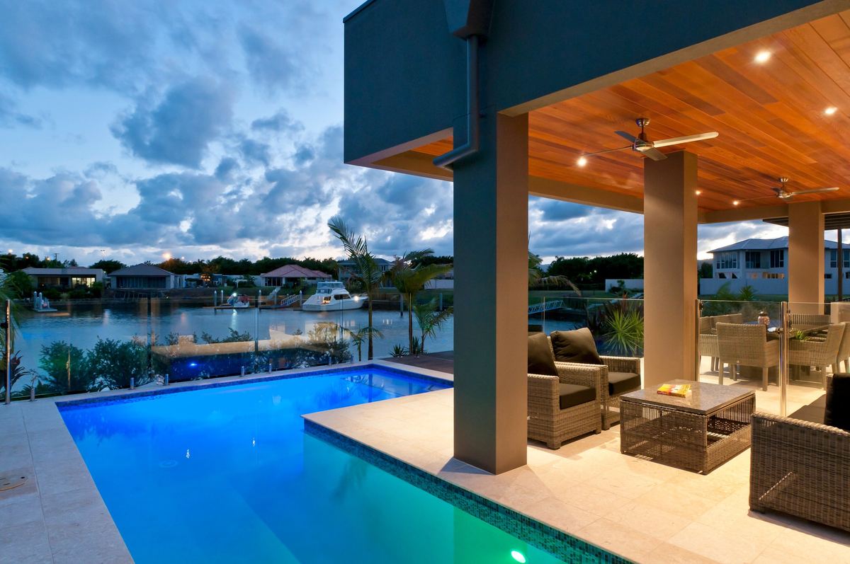 Waterfront pool and alfresco at dusk